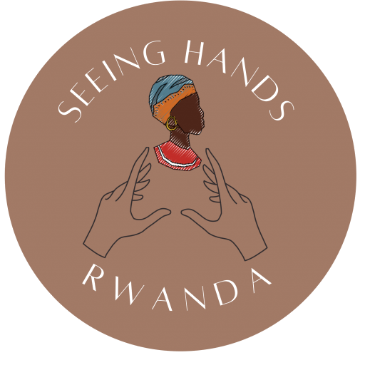 Seeing Hands Rwanda logo. Image of a black woman's head and two hands holding it up. With the words Seeing Hands Rwanda in a circle around the image